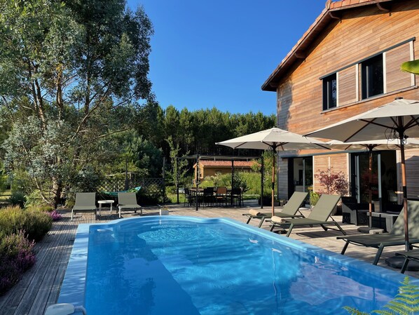 Outdoor pool, pool umbrellas, pool loungers