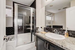 Shower, hair dryer, towels, soap
