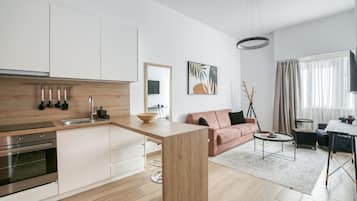 Deluxe Apartment (C1) | Living area | Smart TV