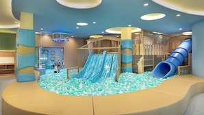 A children's play area with slides and a ball pit.