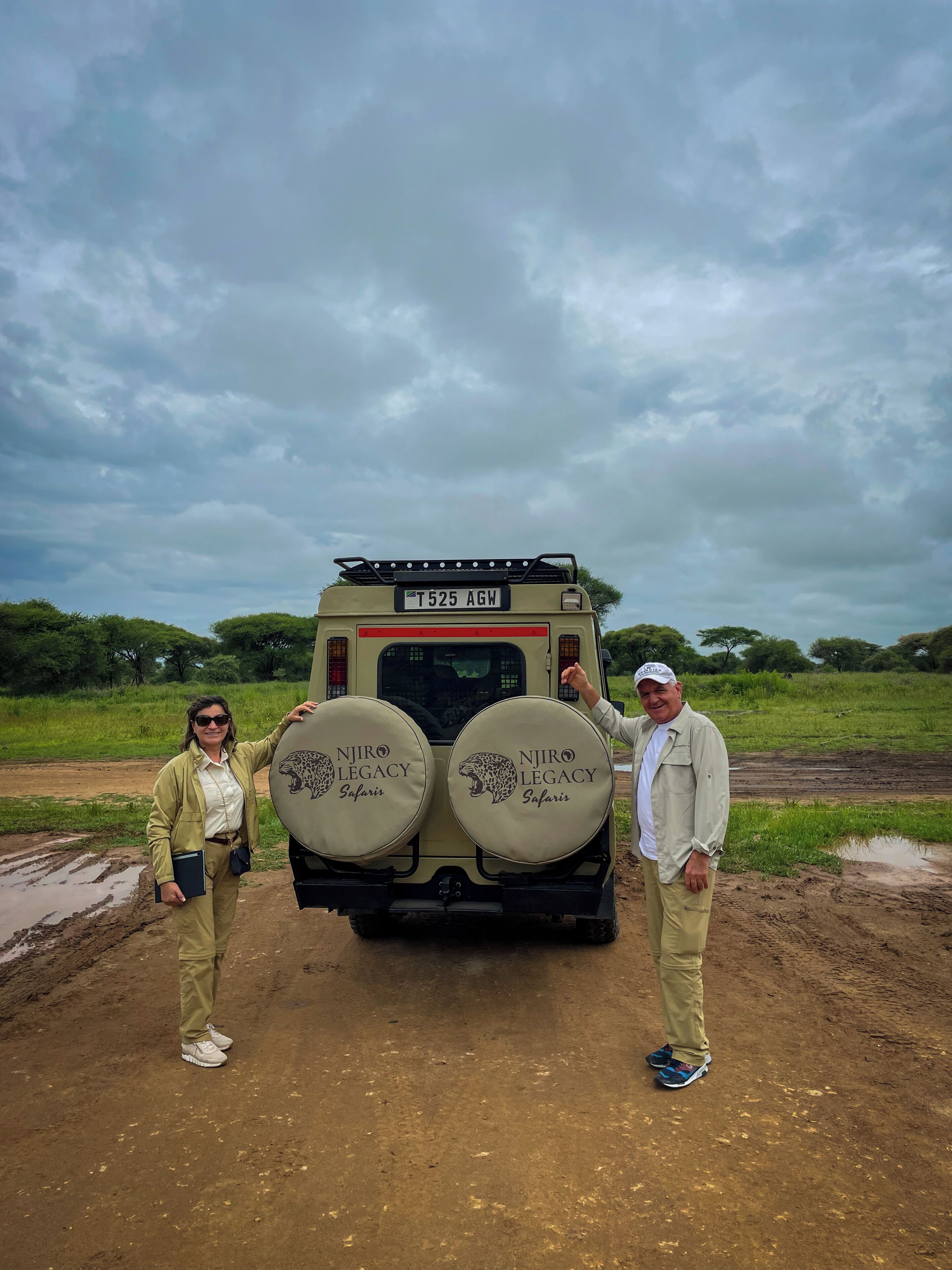 A safari vehicle with two spare tires and a license plate.