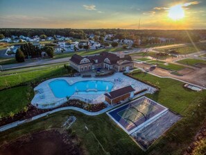 A large house with a swimming pool, tennis court, and a well-maintained lawn. - Ocean View * 5BR Luxury Single Family House! (Ocean View)