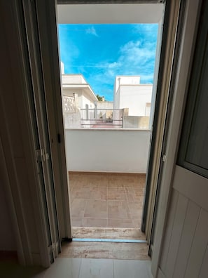 Step out onto the balcony for a view of the surrounding neighborhood.