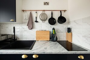 Fridge, microwave, stovetop, cookware/dishes/utensils