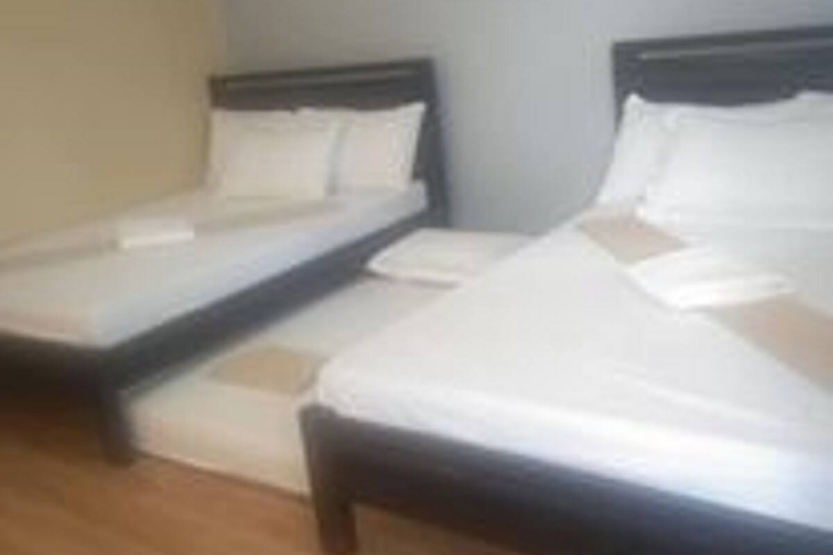 Habitación Deluxe | Caja fuerte y ropa de cama