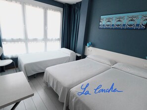 Triple Room, Balcony, Courtyard View | In-room safe, iron/ironing board, free WiFi