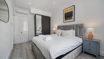 1 bedroom, desk, iron/ironing board, travel crib