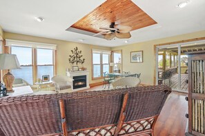 TV, fireplace - Avalon - waterfront home with fireplace and screened porch (Chincoteague Island)