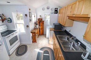 Fridge, microwave, oven, stovetop - Blue Point | Classic Chincoteague Home w/ Wood Stove, Screened Porch, Outdoor Shower & Pets (Chincoteague Island)