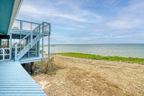 Terrace/patio - Poole's Cove | Waterfront Main Street Retreat Fully Renovated w/ Rooftop Lounge & Artistic Charm (Chincoteague Island)