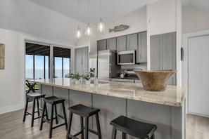 Fridge, microwave, oven, stovetop - Poole's Cove | Waterfront Main Street Retreat Fully Renovated w/ Rooftop Lounge & Artistic Charm (Chincoteague Island)