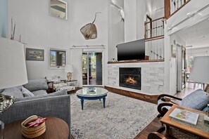 TV, fireplace - Sunshine Daydream | Oyster Bay Canal Waterfront w/ Multiple Porches, Water Views & Dog Friendly (Chincoteague Island)