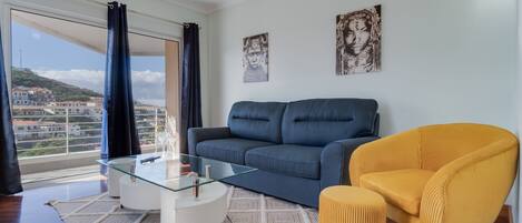 City Apartment | Living area | 52-inch Smart TV with cable channels, TV