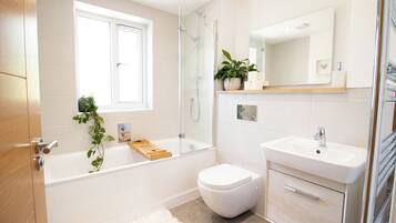 Bathtub, hair dryer, towels