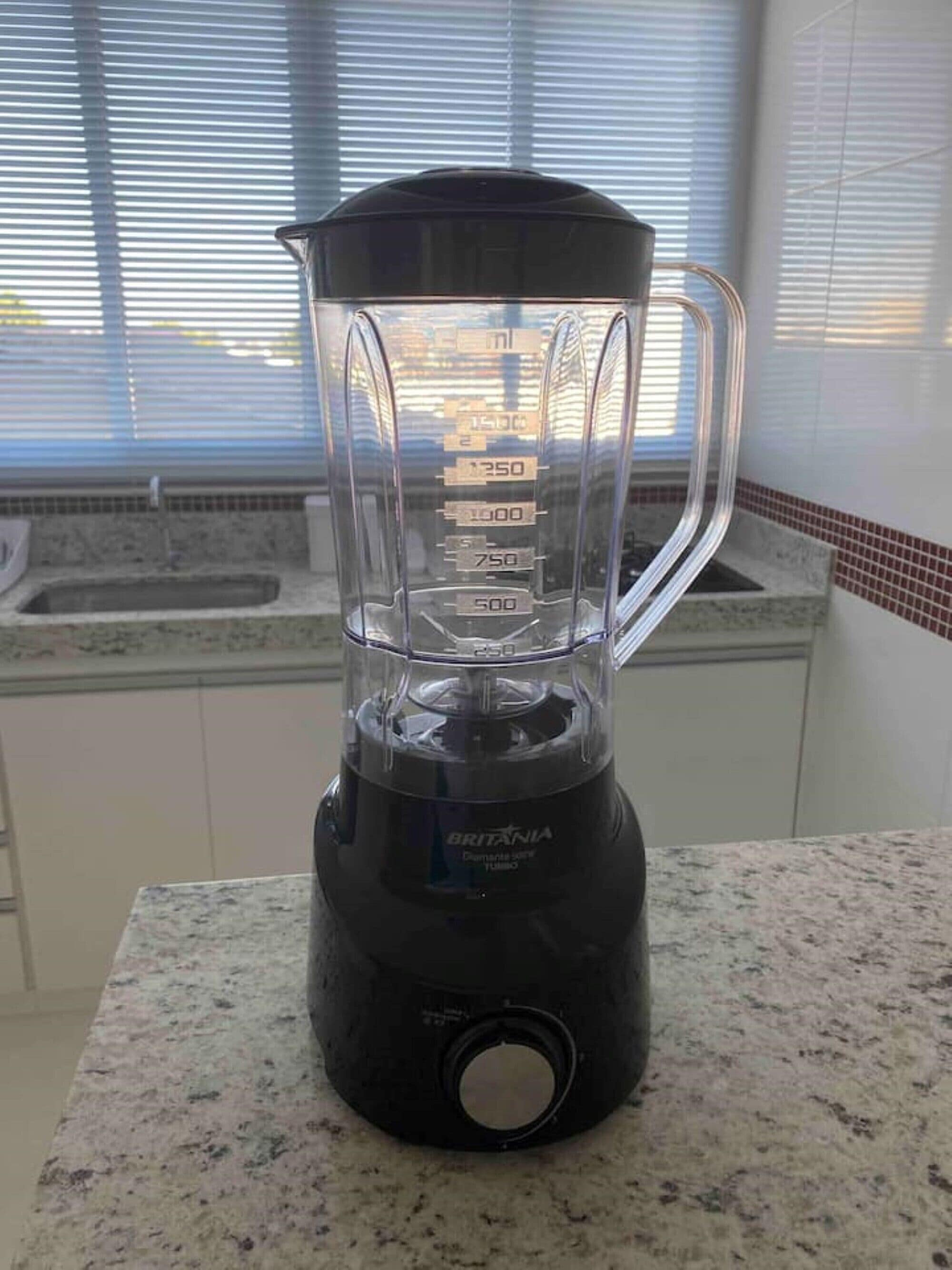 A kitchen with a blender on the counter.