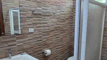 Villa | Bathroom | Shower, rainfall showerhead, towels, toilet paper