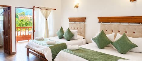 Deluxe Quadruple Room | Premium bedding, down comforters, free WiFi, bed sheets