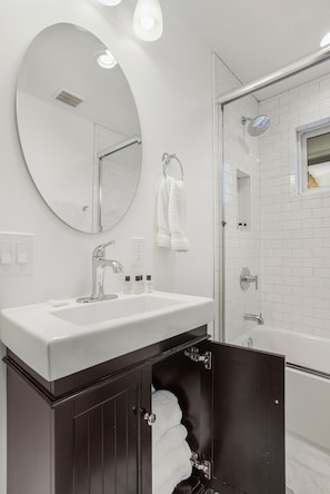 Shower, hair dryer, towels, soap