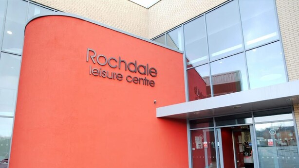A building with a curved facade and a sign reading "Rochdale Leisure Centre". - 3 Bedroom House in Central Rochdale cul-de-sac Free Parking & Fast Wi-Fi (Rochdale)