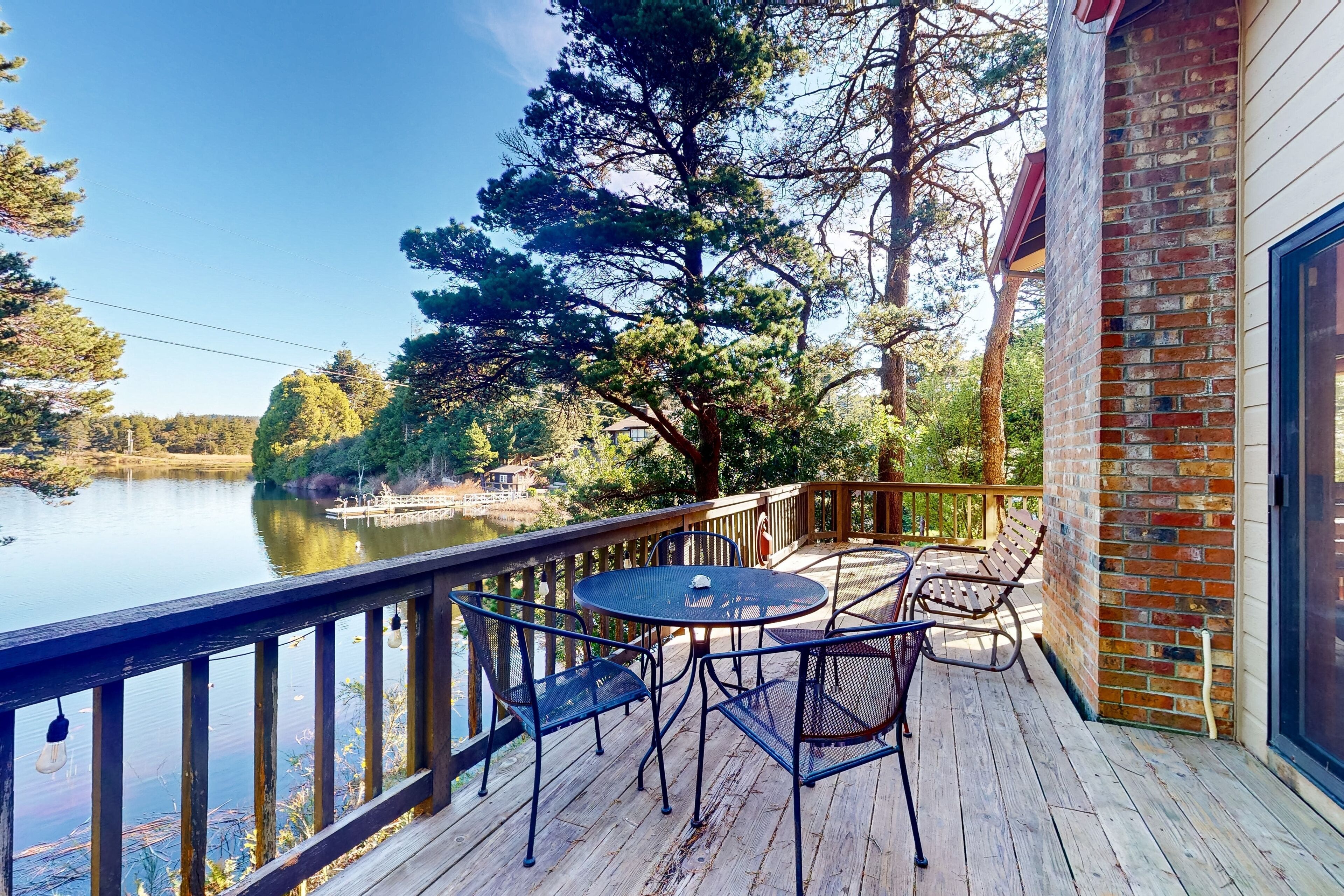 Dog-friendly lakefront home with lake views, deck, partial AC, & W/D