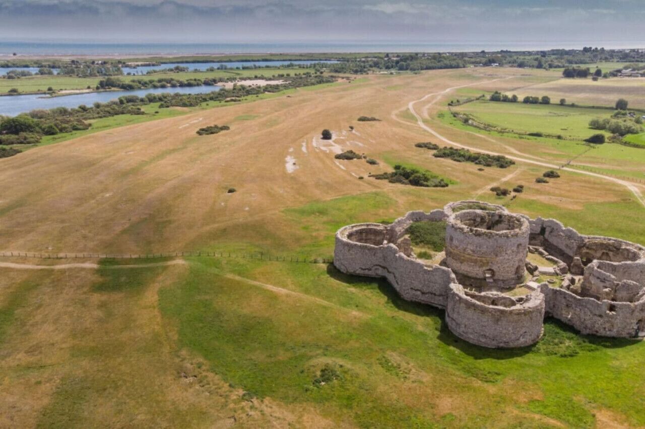 An aerial view of a historical site with ruins and a surrounding landscape.