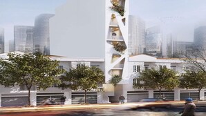 Een modern gebouw met een uniek architectonisch ontwerp, met een centraal atrium, balkons en een plat dak.