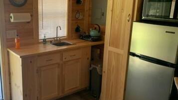 Fridge, microwave, coffee/tea maker, cookware/dishes/utensils