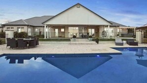 A modern house with a pool, outdoor seating, and a covered patio area. - The York Residence in Hartley NSW - Newly Listed (Hartley)