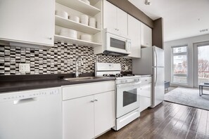 Fridge, microwave, oven, dishwasher - Lovely Somerville 2BR w/ W/D, Gym & Roof, nr Assembly T, by Blueground (Boston)