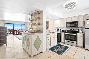Enjoy meals in the kitchen with a central island and ocean views.