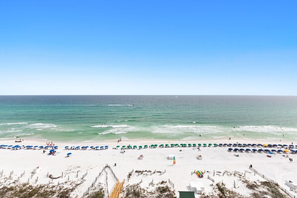 Guests can enjoy a serene beach experience with calm seas and gentle waves.