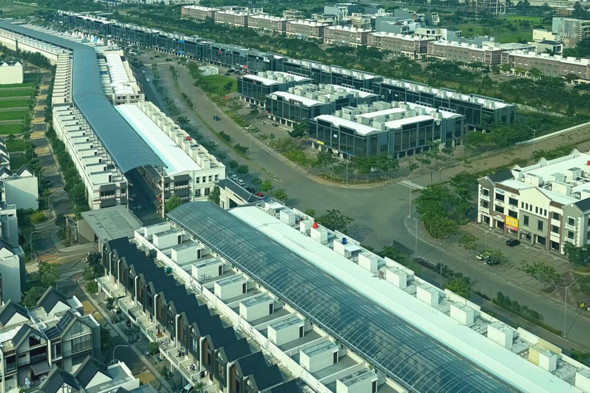 A high-rise building with a modern architectural design, featuring a long, curved structure with multiple levels.