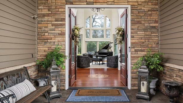 A grand entrance with a piano, a bench, and a welcome mat. - Country Luxury in Manor, Pet Friendly, Hot Tub, Indoor Basketball Ct, Billiards, on 2 Acres (Newberg)