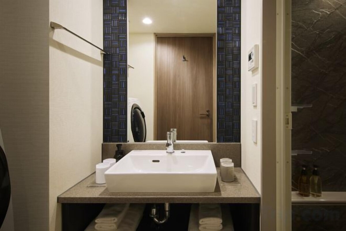 Bathroom | Separate bathtub and shower, hair dryer, slippers, bidet