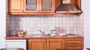 Fridge, cookware/dishes/utensils, dining table, kitchen island - Orionas Village - Two bedroom Maisonette (Chania)