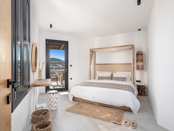 Sarakiniko Smart Suite | Premium bedding, down comforters, in-room safe, individually decorated - Athina Milos Suites (Milos)