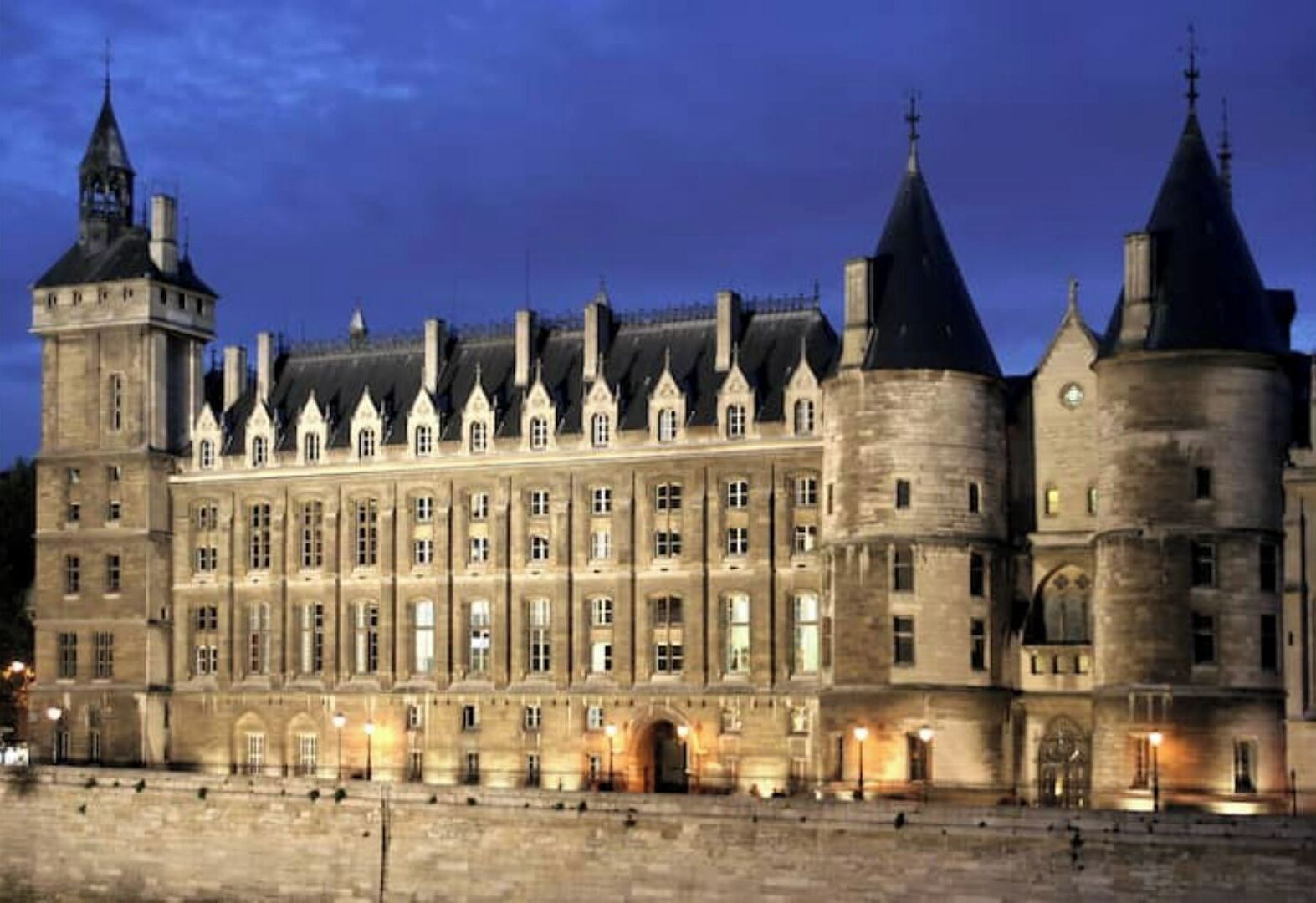 A large, historic building with multiple towers and a symmetrical facade.