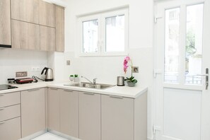 Apartment | Private kitchen | Fridge, oven, stovetop, cookware/dishes/utensils