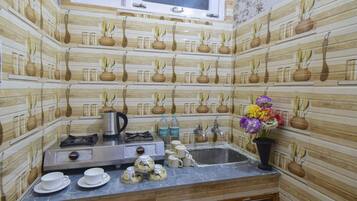 Fridge, stovetop, dishwasher, coffee/tea maker