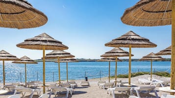 Private beach, white sand, windsurfing