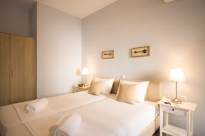 Suite, 2 camere da letto, vista mare | Una cassaforte in camera, ferro/asse da stiro, Wi-Fi gratuito, lenzuola