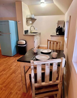 Fridge, coffee/tea maker, cookware/dishes/utensils, paper towels