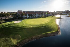 Stunning golf course with manicured fairway and water hazard.
