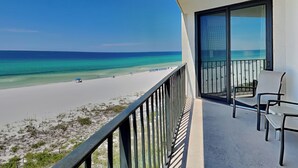 A balcony with a view of a beach and ocean. - Edgewater Tower II #510 | Gulf Front with Resort Amenities (Panama City Beach)