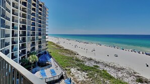 A high-rise hotel with a rooftop pool and beach view. - Edgewater Tower II #510 | Gulf Front with Resort Amenities (Panama City Beach)