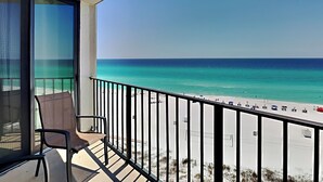 A balcony with a view of a beach and ocean. - Edgewater Tower II #603 | Gulf-Front View + Amenities! (Panama City Beach)
