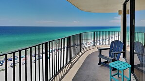 A balcony with a view of a beach and ocean. - Edgewater Tower III #1114 | Gulf Front + Wraparound Balcony (Panama City Beach)
