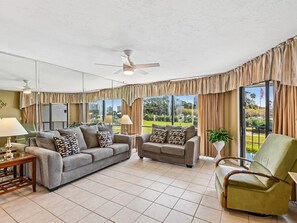 Living Area - Reclining Chair + Balcony Access - Edgewater Villa #1307 | Lake Views + Amenities (Panama City Beach)