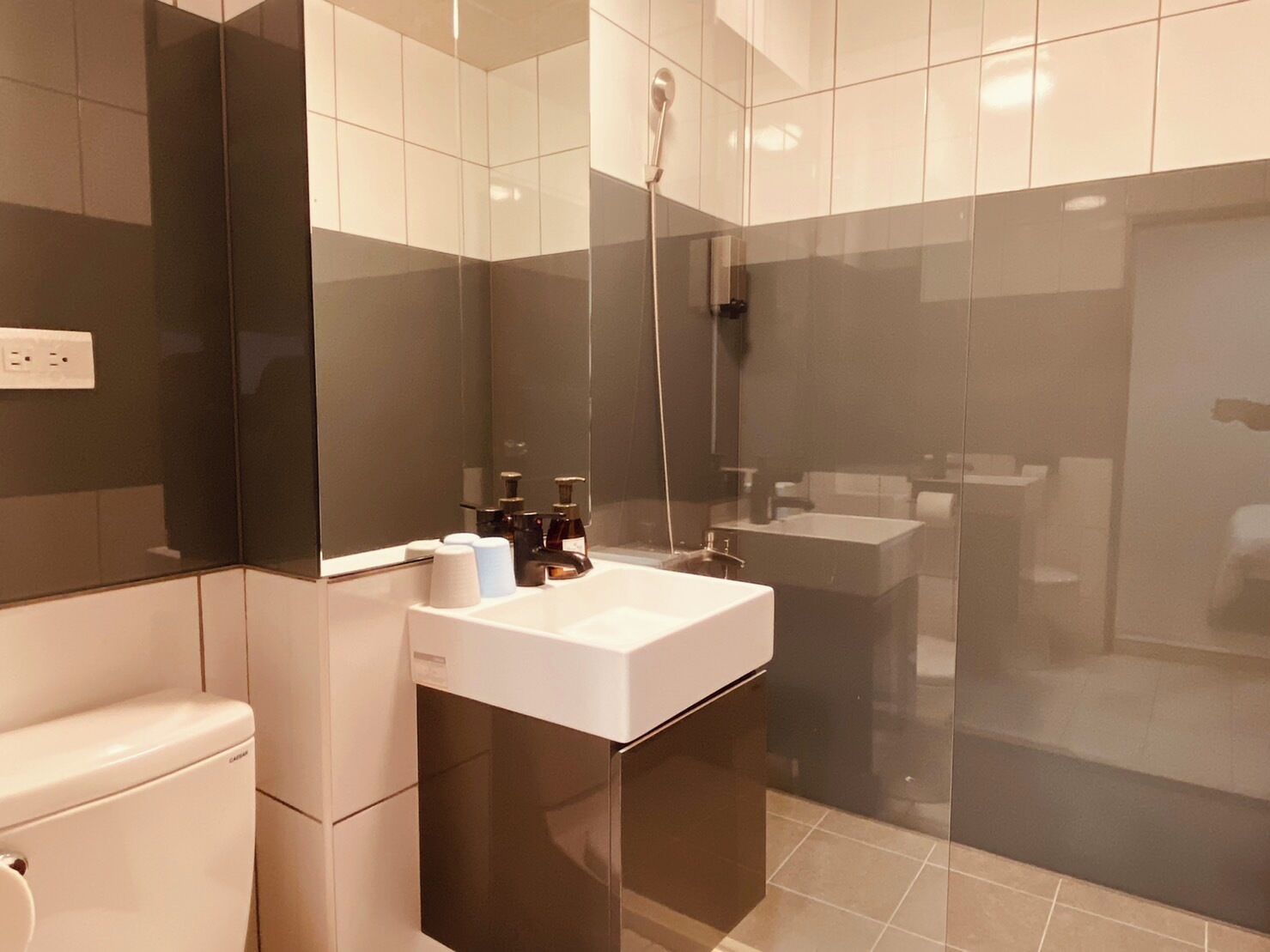 Shower, hair dryer, slippers, towels