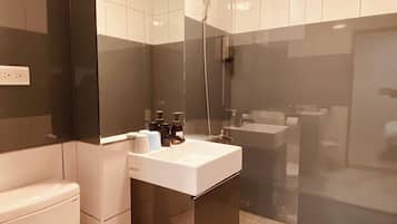 Shower, hair dryer, slippers, towels